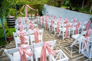 group-of-white-banquet-chairs-decorated-with-pink-2025-02-09-00-21-45-utc